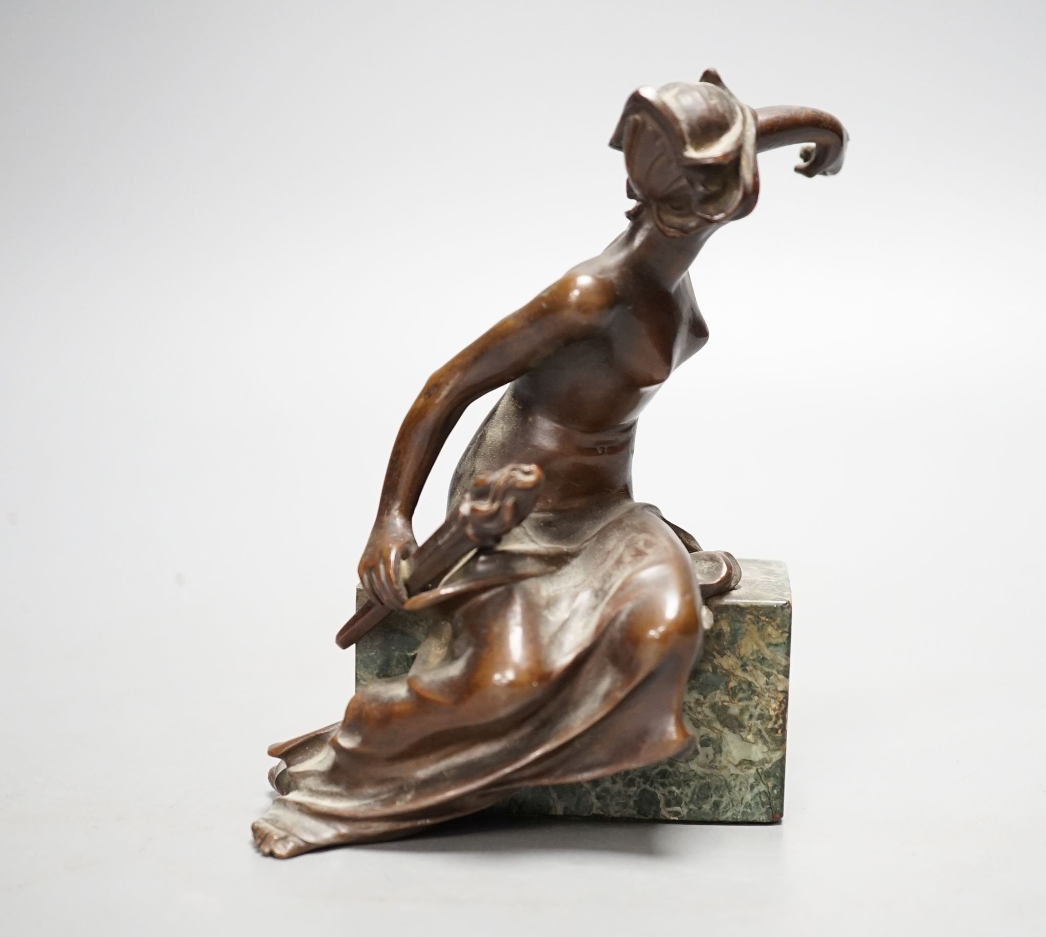 An Art Deco bronze semi-nude seated female, 13 cms high.
